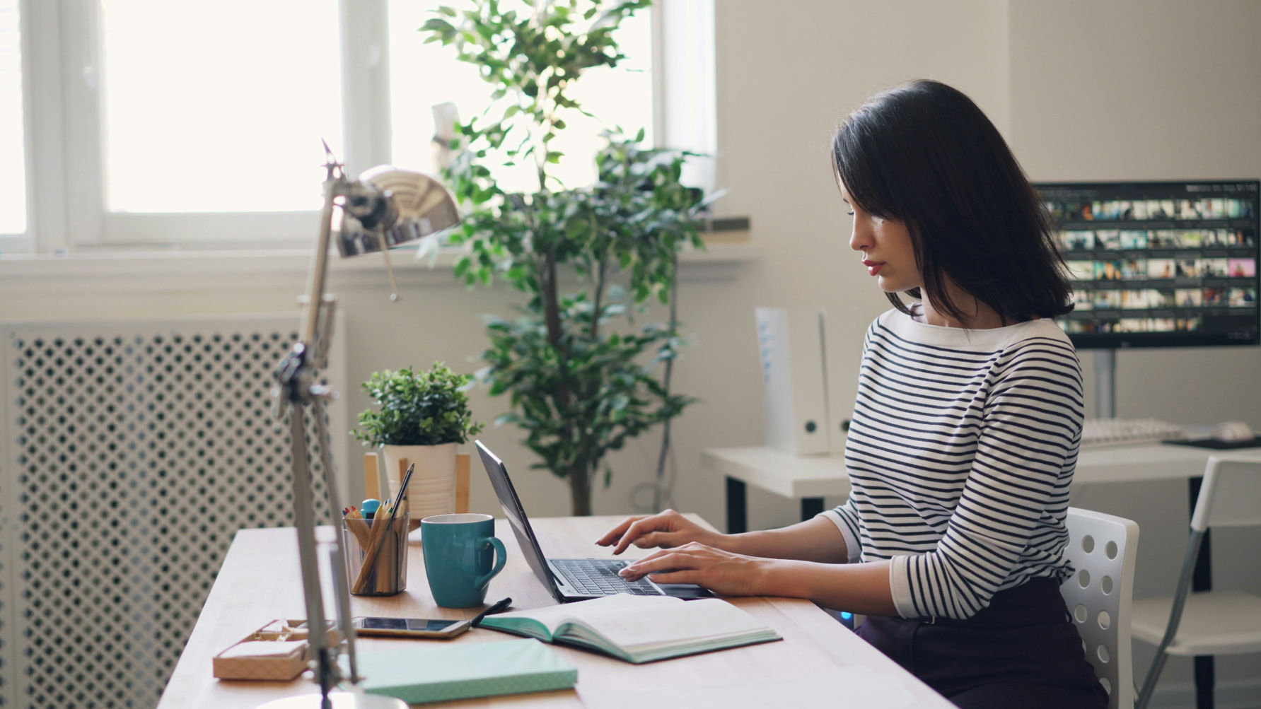 A woman on her laptop working