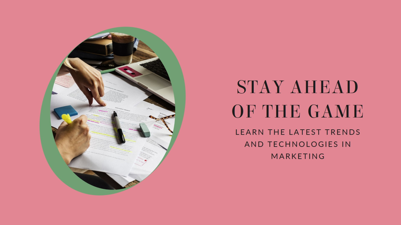 A promotional image featuring a person’s hands working with documents and a digital tablet on a desk, with the text “STAY AHEAD OF THE GAME. LEARN THE LATEST TRENDS AND TECHNOLOGIES IN MARKETING” on a pink background to the right.