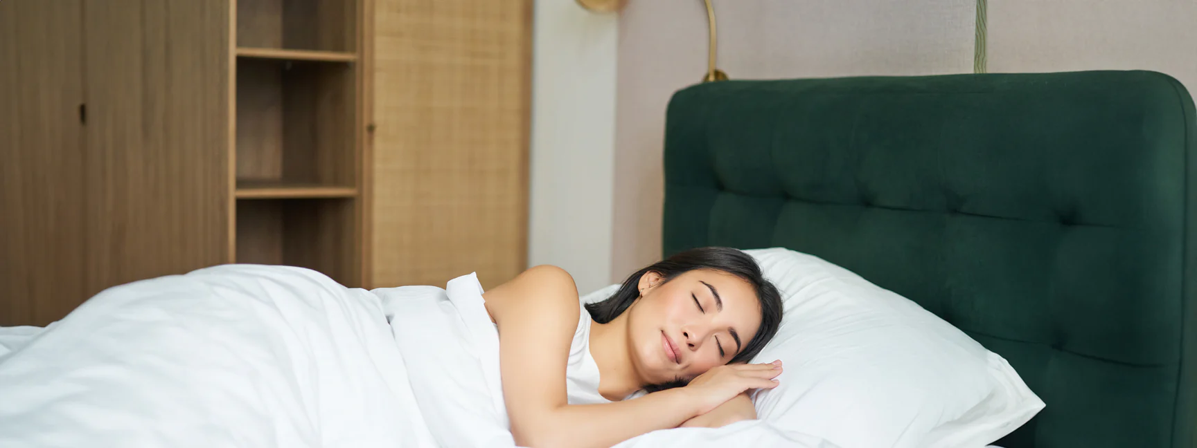 girl happily sleeps happily on a mattress