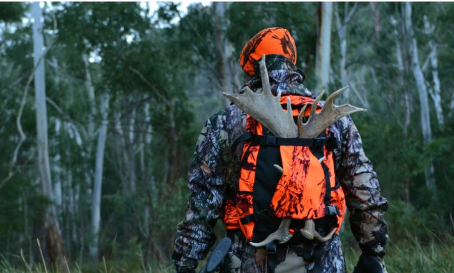 Hunting wearing camo clothing