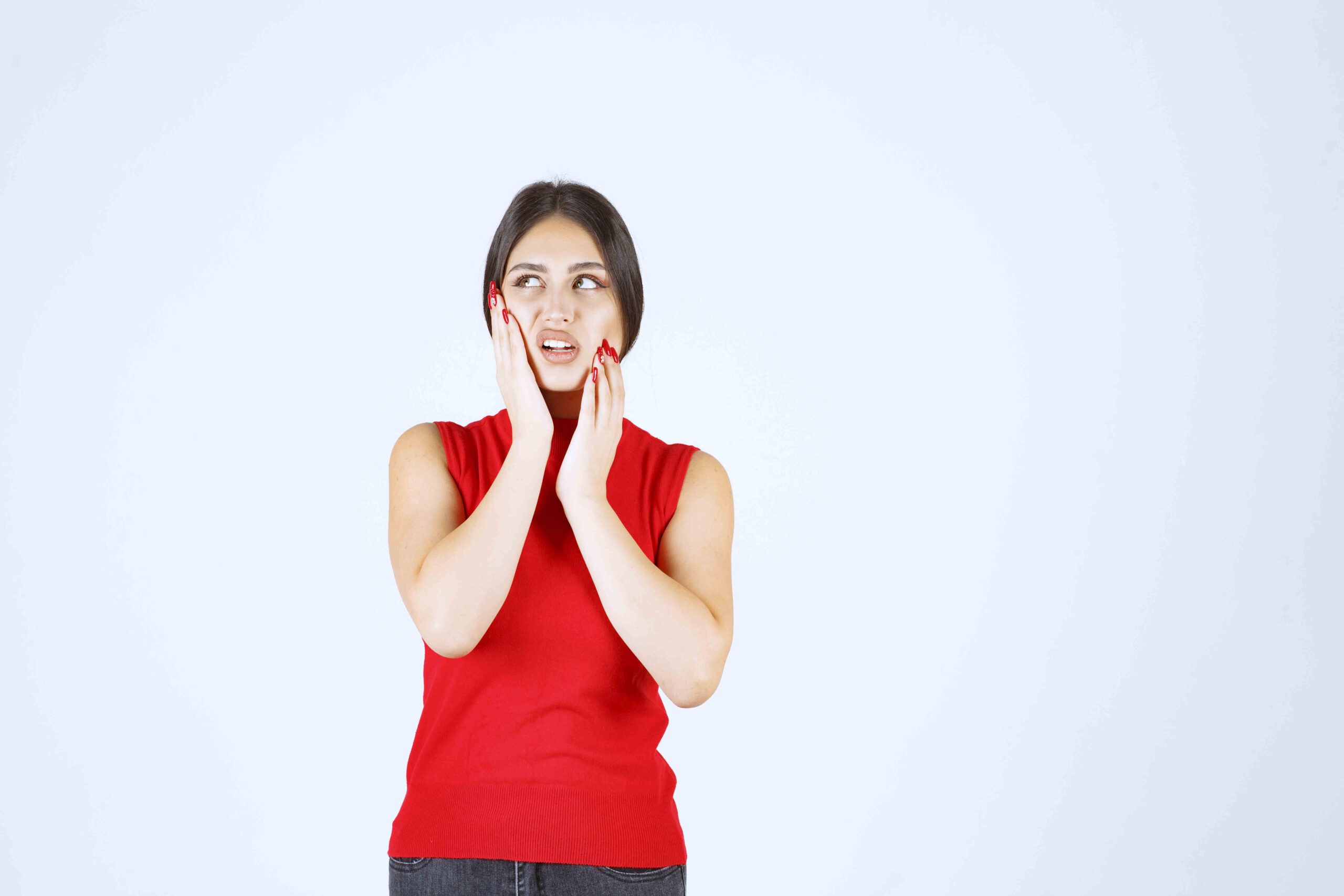 girl facing jaw pain so making annoying face