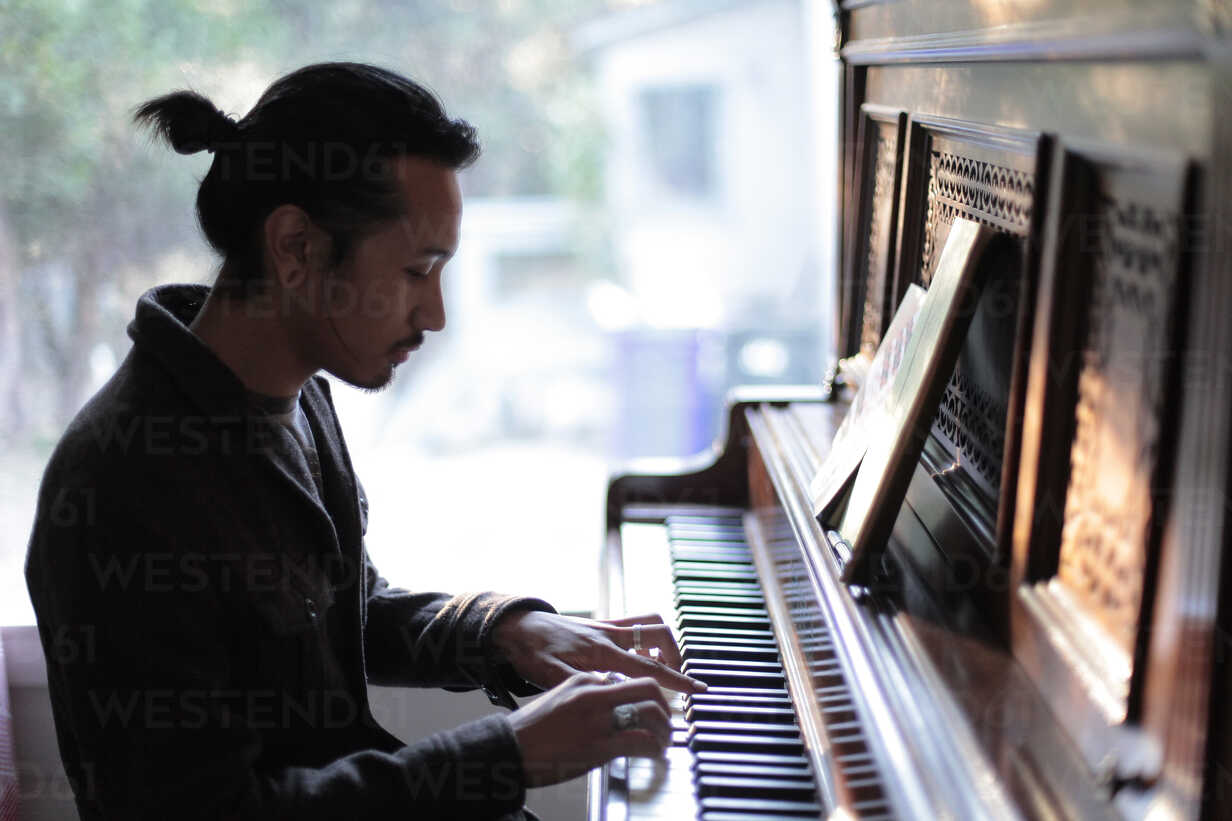 Person playing piano voloacademyofmusic
