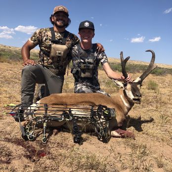 Two hunters with hunting gear and camo clothing
