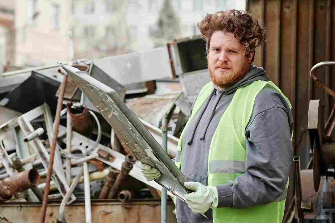 A man is collecting Metal for Recycling