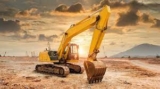 Why should I use factoring service for overseas procurement of construction machinery?