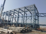 What is the advantages and disadvantages of using structural steel for building construction