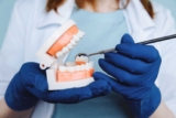 Same-Day Dental Implants vs. Dentures: Which One Wins?