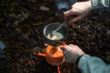 Can I boil water in a titanium cup on a camping trip?