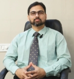 How Can You Reach Dr. Anuj Bhide for Expert Spine Treatment?